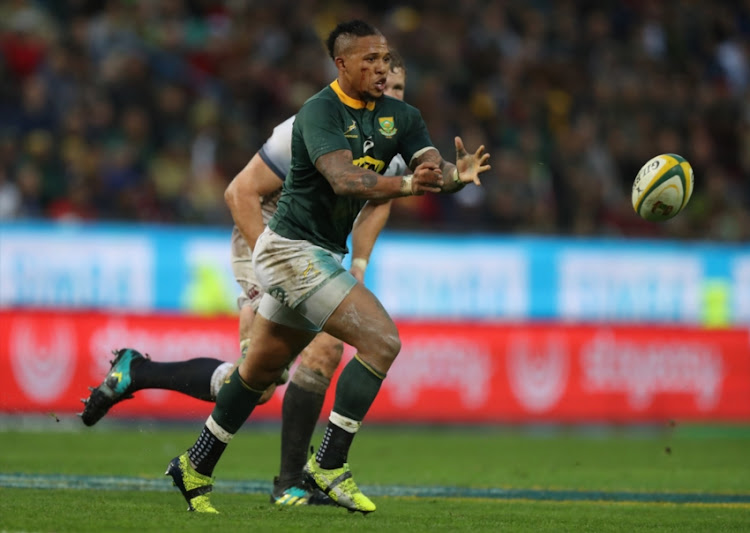 Elton Jantjies of South Africa passes the ball during the third test match between South Africa and England at Newlands Stadium on June 23, 2018 in Cape Town, South Africa.