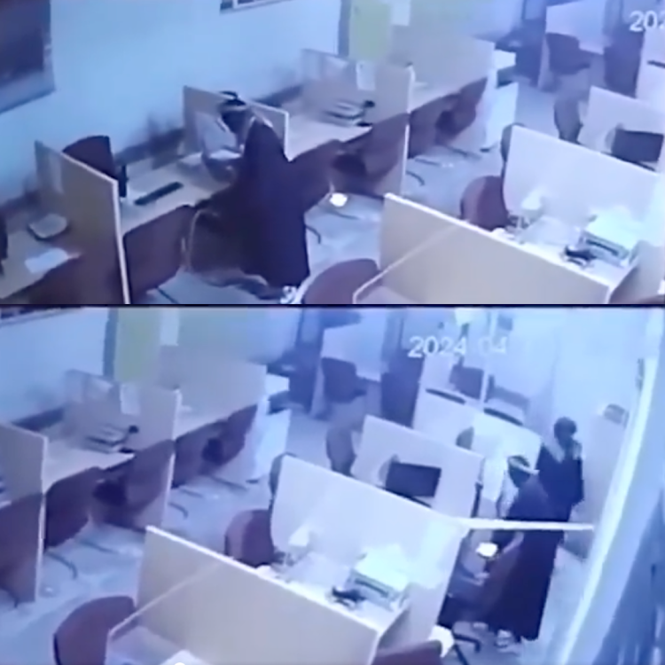 Screenshots from footage where two senior officials and three unknown men were caught on security cameras at Sassa's Mkhondo office allegedly performing rituals after working hours.