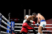 Thabiso Mchunu lands on Yamil Peralta but lost the fight to the Argentine on Friday night.