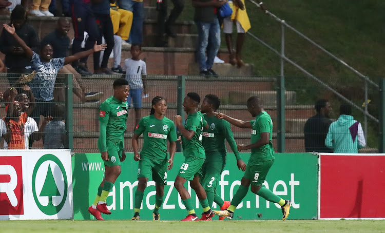 AmaZulu striker Mhlengi Cele celebrates with teammates after scoring during the Absa Premiership match against Mamelodi Sundowns at King Zwelithini Stadium in Umlazi, south-west of Durban, March 2 2018.