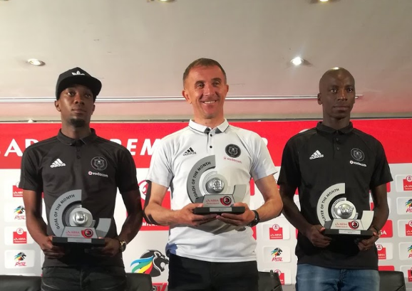 Orlando Pirates head coach Milutin Sredejovic is flanked by players Musa Nyatama (R) and Justin Shonga (L) at the PSL Offices in Johannesburg Thursday April 5 2018.