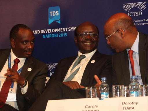 Former East Africa Community Secretary General Richard Sezibera with the United Nations Conference on Trade and Development Secretary-General Mukhisa Kituyi with the Industrialization Cabinet secretary Adan Mohamed at the TMEA trade development conference in Nairobi, Hilton Hotel on December 15,2015. /ENOS TECHE