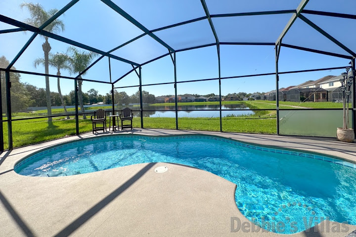 Stunning lake view from the south-facing pool deck of this Kissimmee vacation villa