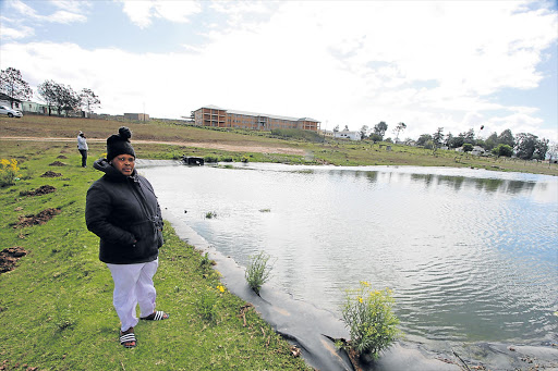 TRAGEDY: Nokulunga Njemla next to one of the dams where her son drowned Picture: LULAMILE FENI