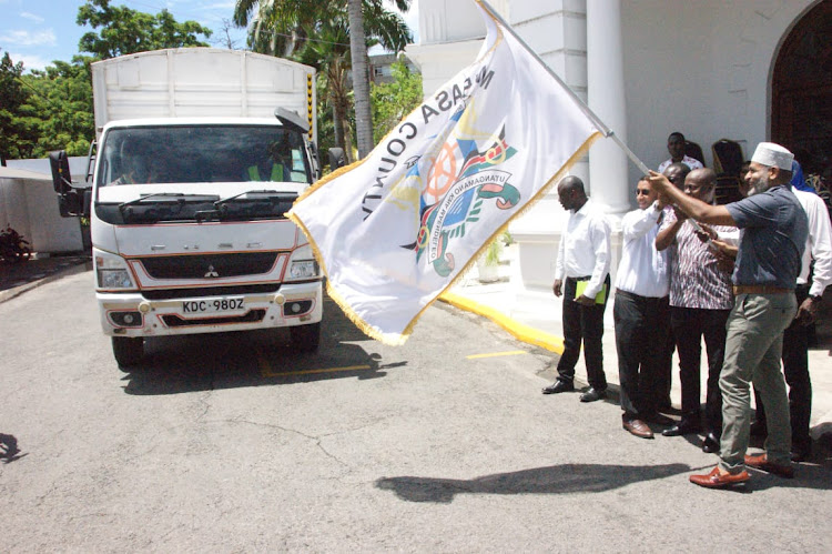 Mombasa governor Abdulswamad Nassir accompanied with CEO KEMSA Dr.Andrew Mulwa flags off the 932,000 mosquito nets outside his office for distributions to sub counties on March 21, 2024.