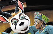 WHAT THE BUCK? A rugby fan and a mascot during a farewell in Johannesburg for the Springboks before they left for the World Cup in England. How disconnected is the Rainbow Nation narrative from the reality of black lives?