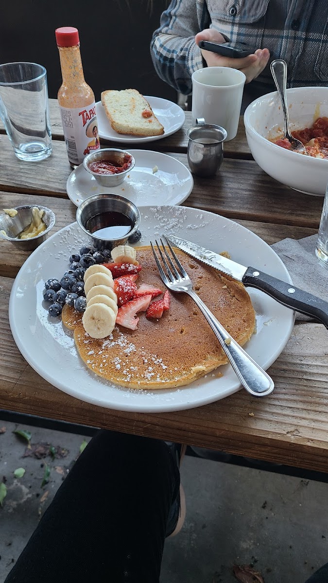 Half of the vegan pancakes with fruit.