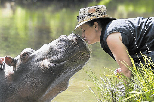 PULLING HER WEIGHT: Jessica the hippo shares a kiss with Shirley Joubert back in 2004.