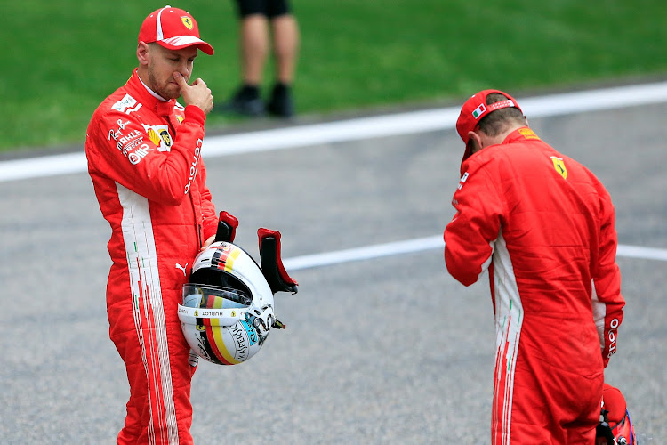 Ferrari's Sebastian Vettel and Ferrari's Kimi Raikkonen after qualifying.