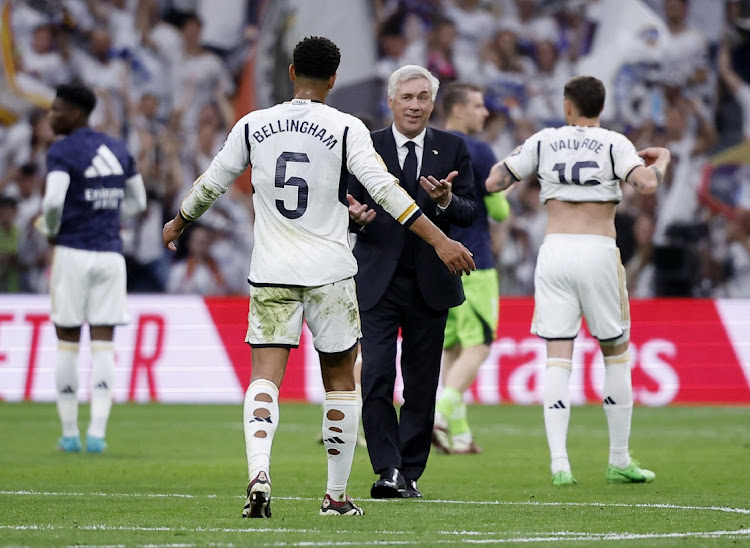 Real Madrid coach Carlo Ancelotti and Jude Bellingham celebrate after beating Cadiz. Picture: JUAN MEDINA/REUTERS