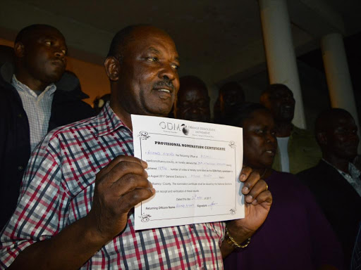 Kisumu Governor Jack Ranguma displays his provisional ODM nomination certificate at Aga Khan Hall, April 25, 2017. /FAITH MATETE