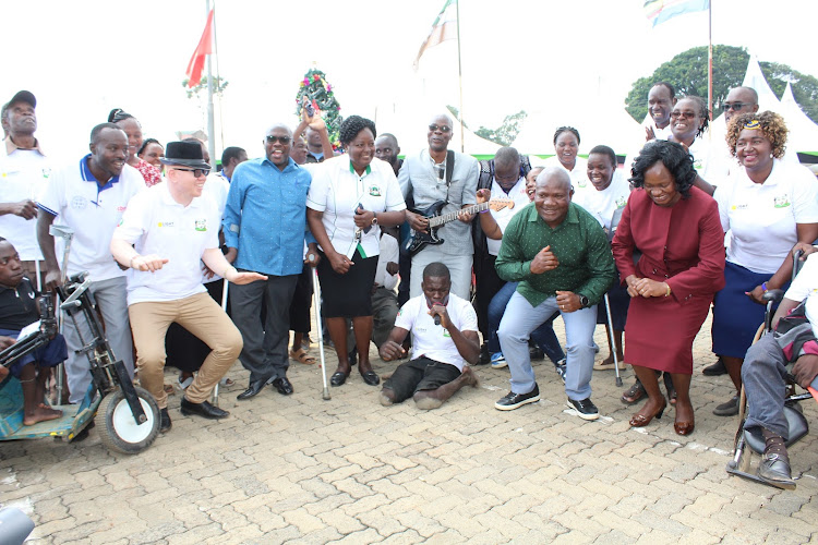 Kakamega governor Fernandez Barasa joins a music dance by the persons living with disability at Bukhungu on Friday