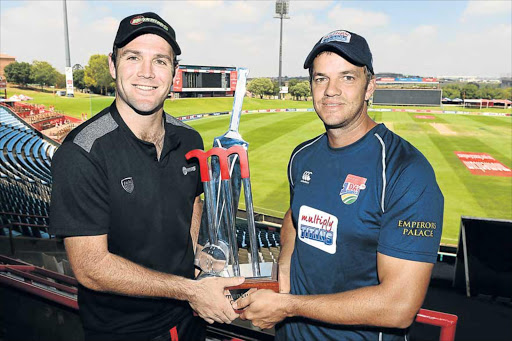 TUG-O-WAR: Warriors’ captain, Jon-Jon Smuts, left, and Albie Morkel of the Titans pose with the trophy during the Momentum One-Day Cup final media briefing at SuperSport Park yesterday. The teams will be playing a final for the second time this season after the Titans’ victory in the T20 Challenge in December Picture: GALLO IMAGES