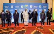 Leaders from the Economic Community of West African States (ECOWAS) pose during an extraordinary summit to discuss a proposal by transitional authorities in Mali to delay elections and return constitutional rule, in Accra, Ghana on January 9, 2022.