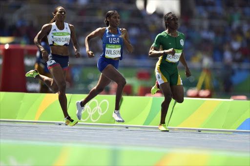 Caster Semenya, USA's Ajee Wilson and Britain's Shelayna Oskan-Clarke compete in the Women's 800m Round 1 during the athletics event at the Rio 2016 Olympic Games at the Olympic Stadium in Rio de Janeiro on August 17, 2016.