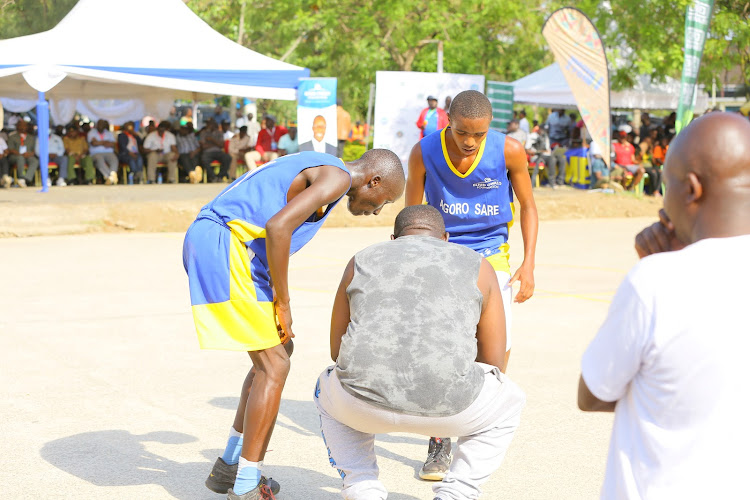 Agoro Sare coach Paul Odok gives instructions to his players during the Eliud Owalo basketball tournament