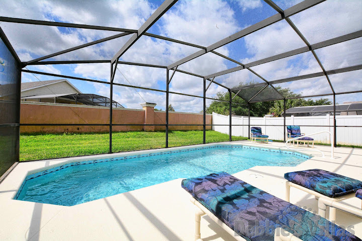 Soak up the sun and chill with a book or two on the pool deck of this Kissimmee vacation villa