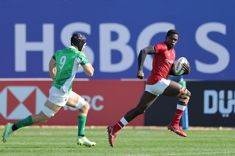 Kenya sevens co captain Vincent Onyala outsprints a a Mexican opponent during the Challenger sevens tournament in Dubai last weeeknd