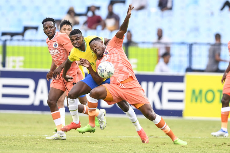 Tebhoho Mokoena of Mamelodi Sundowns ,middle, feels the heat of Thami Gabuza of SuperSport United during the Tshwane derby at Loftus Versfeld, Pretoria on January 16.