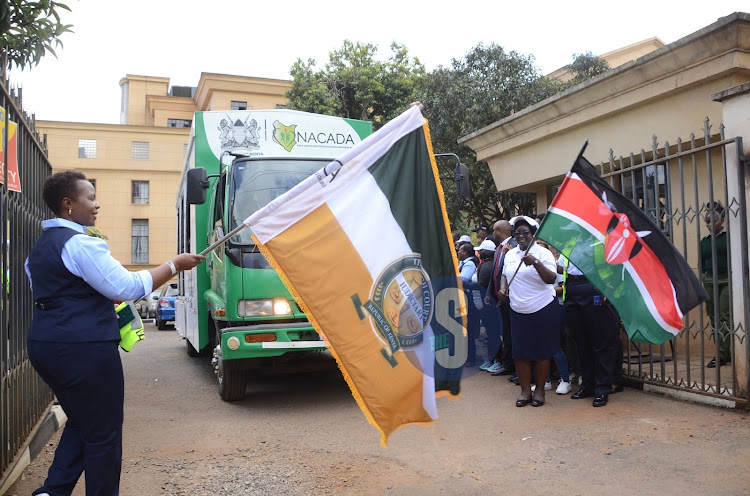Chief Magistrate Susan Shitubi together with magistrate Esther Kimilu flagging off a caravan at Milimani Law Courts during a two days traffic open day to sensitize members of public and other road users on road safety on March 20, 2024