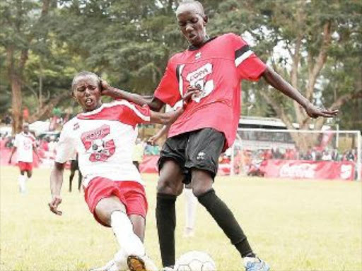 St. Anthony’s Leonard Mwangi vies for the ball with Wahundura’s George Kamau during a past match. /COURTESY