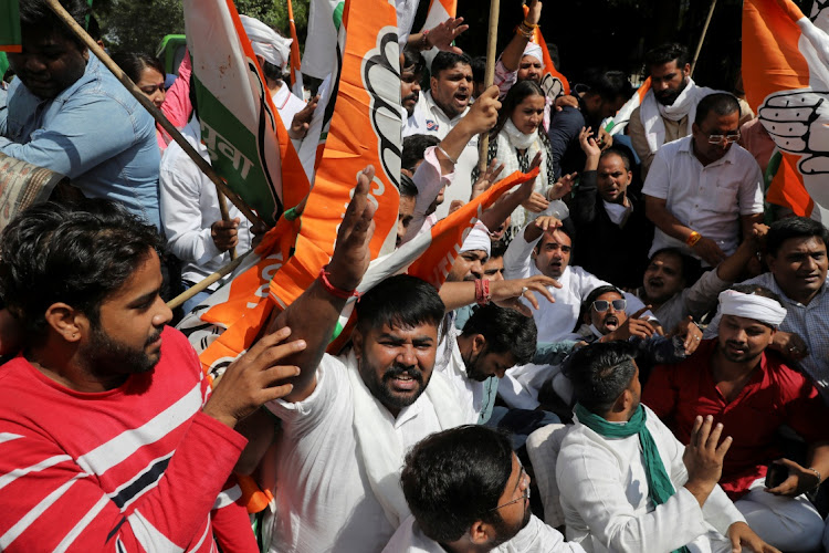 FILE IMAGE: Activists of the youth wing of India's main opposition Congress party take part in a protest outside UP Bhawan, after people were killed when violence broke out in India's Uttar Pradesh state on Sunday, when a car linked to a federal minister ran over farmers taking part in a protest against controversial farm laws, in New Delhi, India, October 4, 2021.