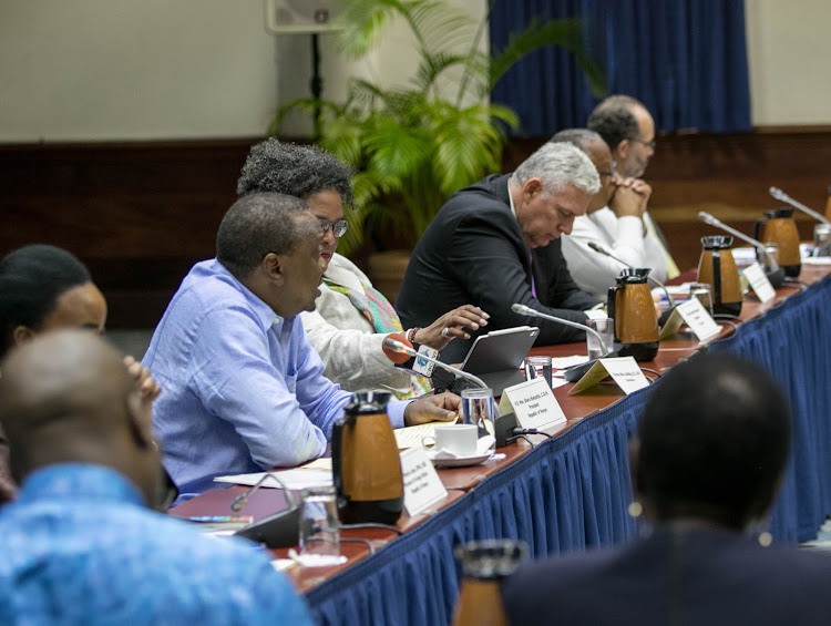 President Uhuru Kenyatta accompanied by Prime Minister Mia Amor Mottley makes his address during a meeting with Caribbean Heads of Government at Lloyd Erskine Sandiford Centre, Bridgetown, Barbados.