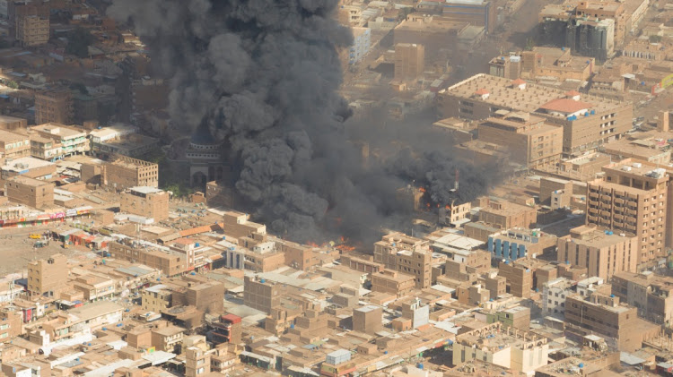 A screen grab shows black smoke and fire at Omdurman market in Sudan on May 15 2023. File photo