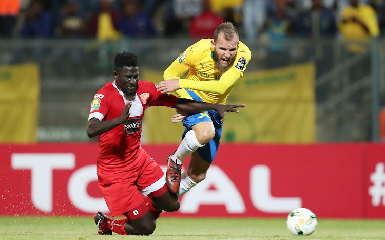 Jeremy Brockie of Mamelodi Sundowns fouled by Aboubacar Camara of Horoya during the 2018 CAF Champions League match between Mamelodi Sundowns and Horoya at the Lucas Moripe Stadium, Atteridgeville on 28 August 2018.