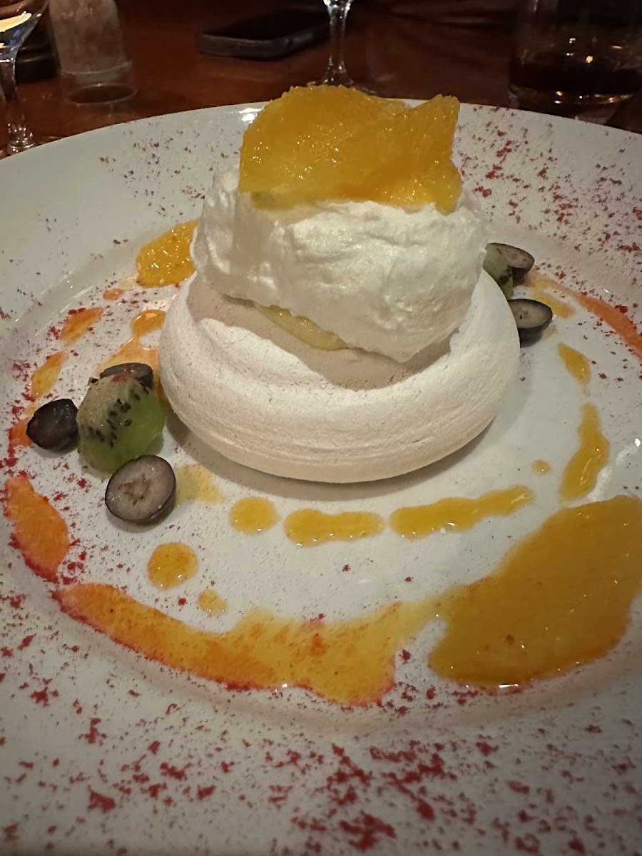 Crispy meringue with lemon curd and passion fruit coulis