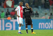 Orlando Pirates captain Oupa Manyisa (R) with Lebohang Mokoena of Ajax Cape Town during the Absa Premiership match at Orlando Stadium on May 17, 2017 in Johannesburg, South Africa.