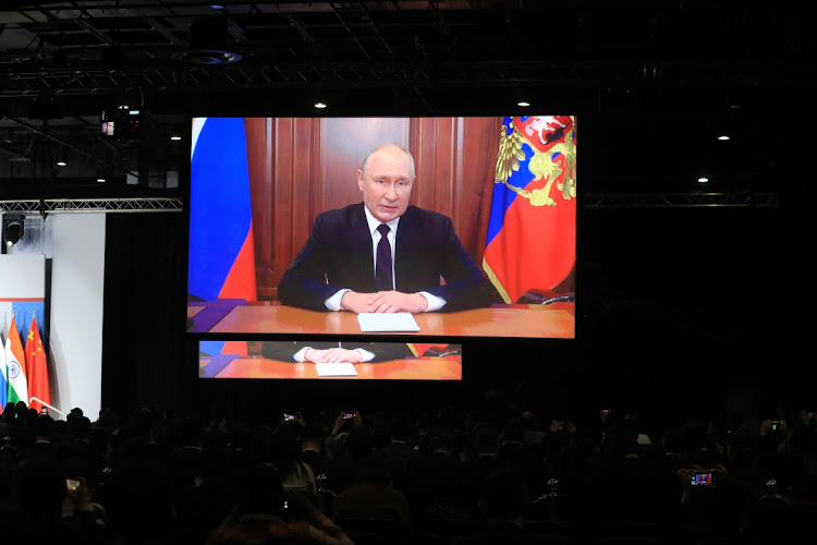 President of Russia Vladimir Putin addresses the Brics business forum in Sandton, Johannesburg, through a video link.