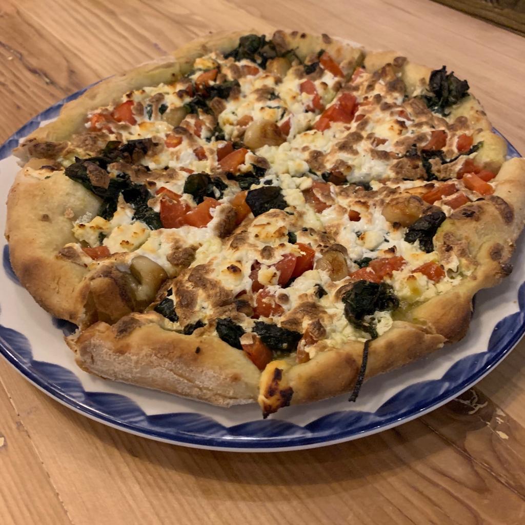 Eggplant, tomato, garlic, feta and mozzarella cheese pizza