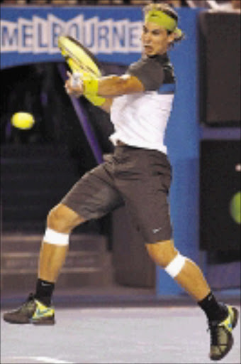 NEW LOOK: Spain's Rafael Nadal returns to Belgium's Christophe Rochus in the men's singles match during the Australian Open in Melbourne Australia yesterday. 20/01/2009. © AP Photo. Pic. Rick Stevens.