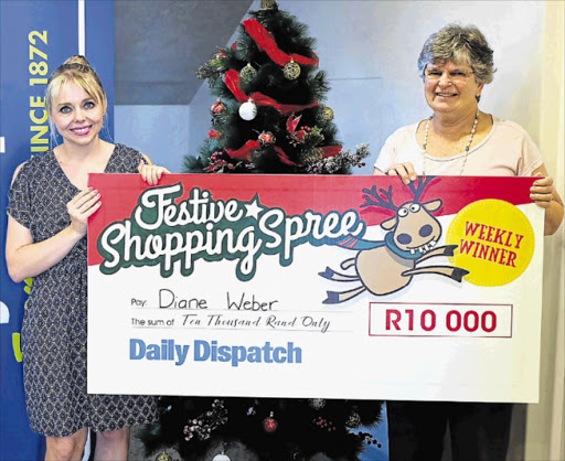 HAPPY: R10000 Festive Shopping Spree winner Diane Weber, right, with Daily Dispatch acting marketing manager Penelope Smith Picture: ALAN EASON