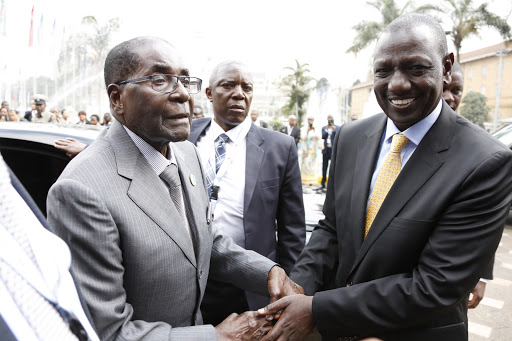 Deputy President William Ruto receives Zimbabwe President Robert Mugabe when he arrived for the TICAD conference, Nairobi. /DPPS