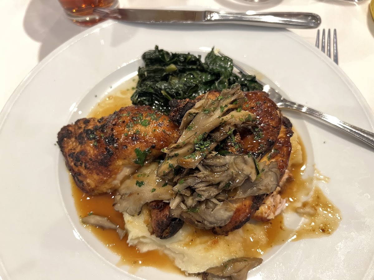 Roasted 1/2 chicken on whipped yukon potatoes, sauteed kale, maitake mushrooms and chicken jus