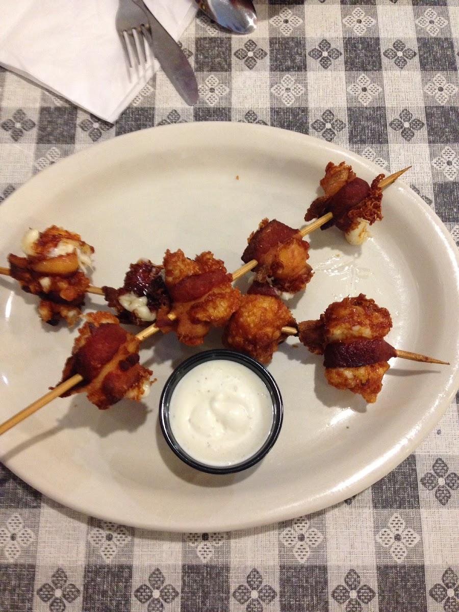 GF bacon wrapped fried cheese curds. Delicious and crispy! The ranch sauce was a great addition.