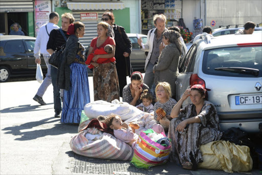 Gypsies gather in a street of the southern French city of Marseille on October 2, 2012 after a group of thirty people were evicted by the police.