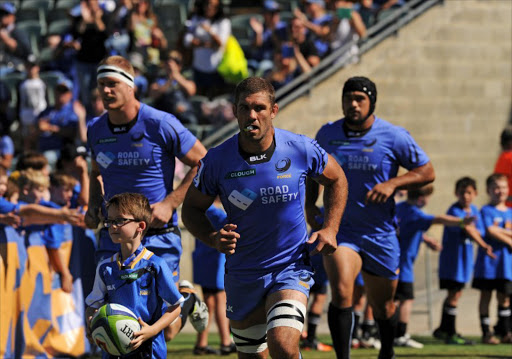 Western Force captain Matt Hodgson (C) leads his team out to start the Super Rugby match between Australia’s Western Force and South Africa’s Kings in Perth on April 9, 2017.