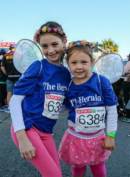 Young racers representing The Herald Leila Searle,7 and Kyra Searle, 3 at the start of the 5km race