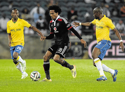 HEMMED IN: Issa Sarr of Orlando Pirates on the attack during the Absa Premiership match against Mamelodi Sundowns at Orlando Stadium, Soweto, last night. Pirates produced a better effort but could not get a winner