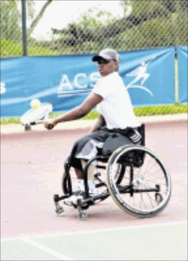 ON THE BALL: South Africa's number one woman wheelchair tennis player, Kgothatso Montjane, shows what it takes to succed. Cicra 2008. Pic. Unknown