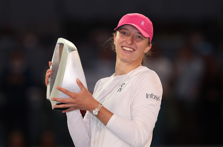 Iga Swiatek poses with her trophy after victory against Aryna Sabalenka at the Madrid Open in Spain, May 5 2024. Picture: Julian Finney/Getty Images