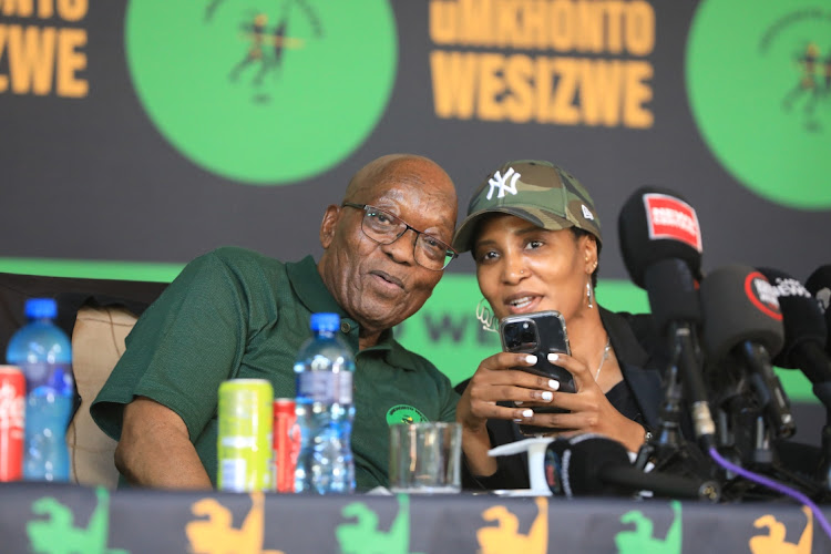 Former president Jacob Zuma and his daughter Duduzile at a media conference.