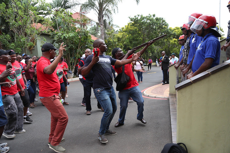 Striking DUT staff protest outside the Vice Chancellors office in Durban as Mi7 security block access to the building. File photo.