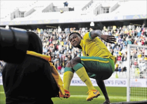 CONFIDENT: Thamsanqa Gabuza celebrates after scoring a goal for Bafana Bafana in a friendly against Angola at Cape Town Stadium recently PHOTO: Ryan Wilkisky/ BackpagePix