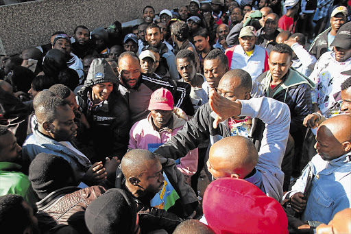 Violence erupts outside a Home Affairs office as asylum applicants wait for the documentation that will regularise their presence in South Africa