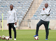 Bafana Bafana head coach Molefi Ntseki (R) and his assistant Arthur Zwane (L) during a training session.   