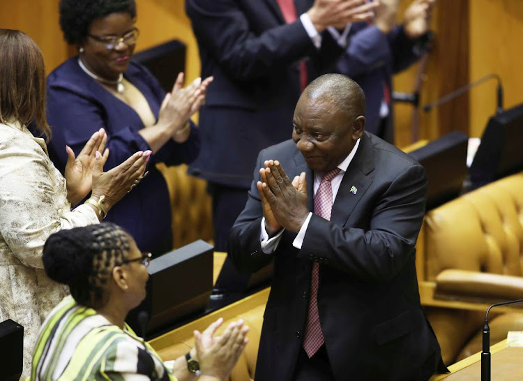 Cyril Ramaphosa is applauded by incoming MPs in the National Assembly on Wednesday.